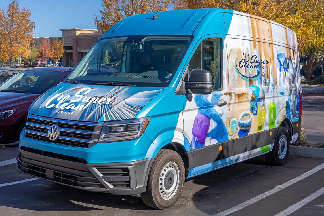 Professional vehicle wrap created with large-format printing technology for mobile advertising and visual communication. This vibrant display example showcases an effective ground-level promotional solution. Vehicle wraps, like banners and rollups, deliver durable, high-visibility advertising for commercial brand campaigns.