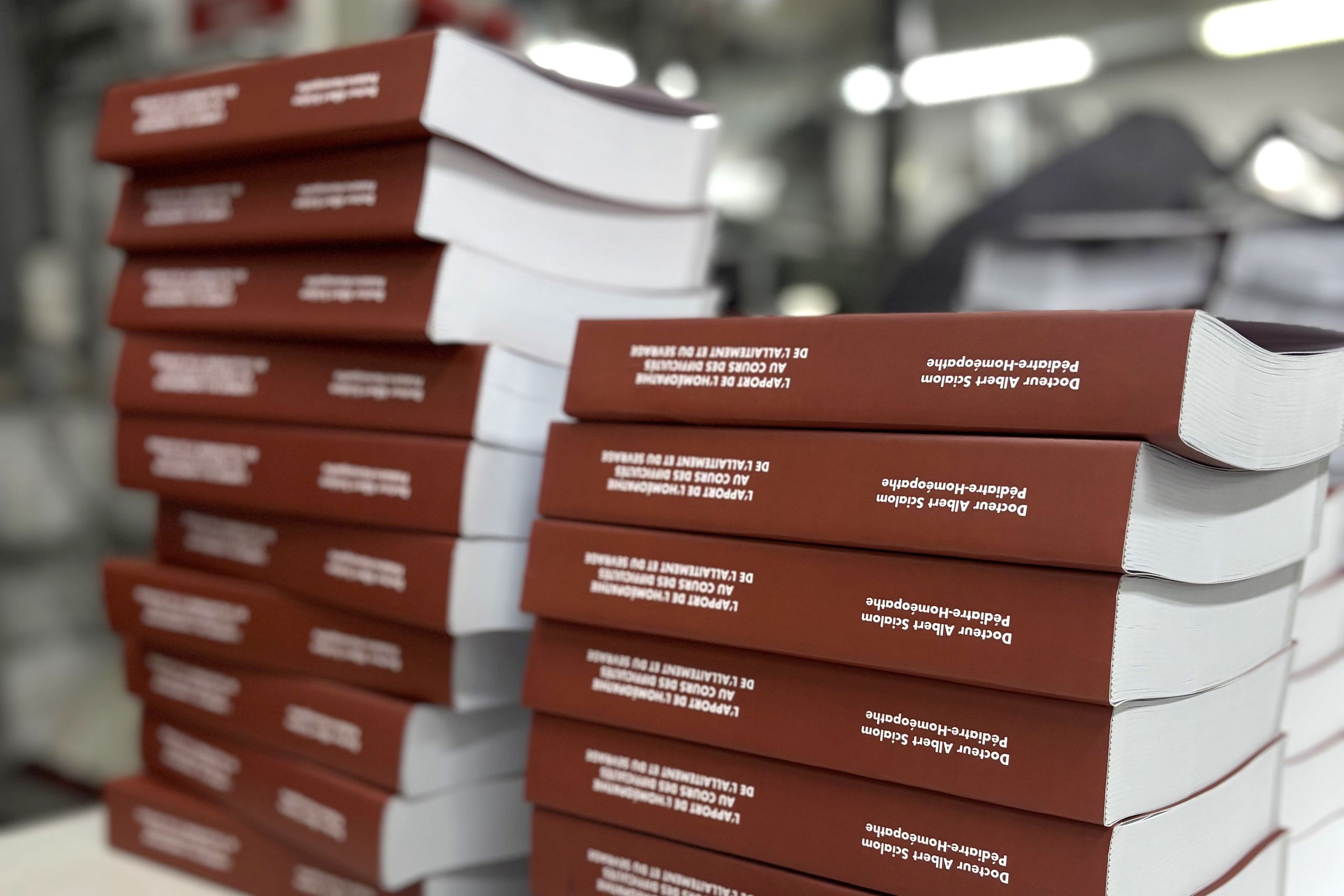 Professionally printed hardcover books stacked for editorial. Custom hardcover books for editorial publishing projects including catalogues and magazines. Sprint24.