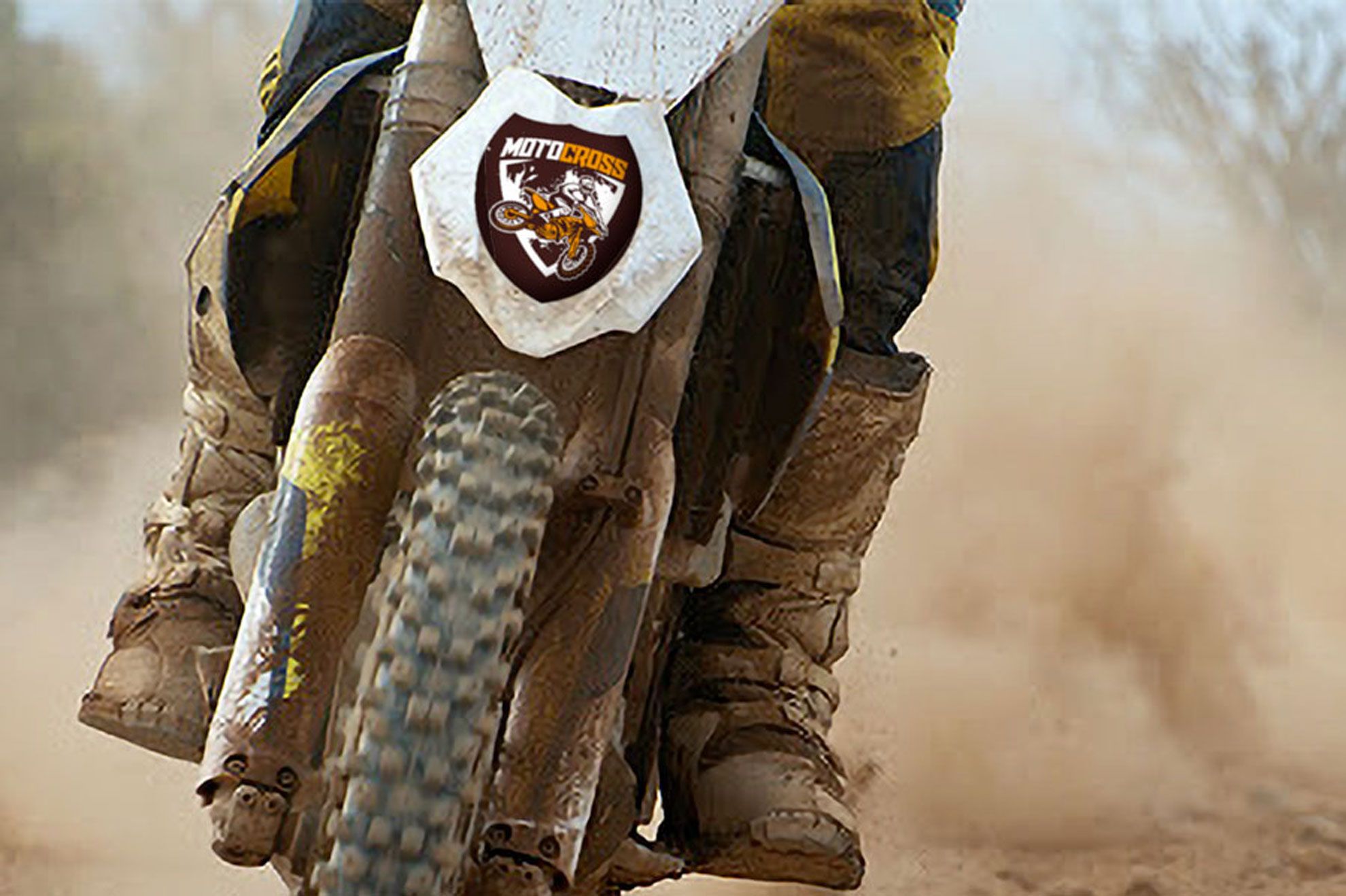 Custom-shaped shield sticker applied to a motorcycle wheel, showcasing durable sticker printing for motorsports and vehicle branding. This example demonstrates how personalized sticker designs withstand outdoor conditions and heavy use. Order your custom shape stickers online at Sprint24 for sports, vehicles, and promotional applications.