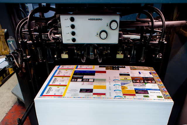 Professional offset printing machine produces large 70x100 cm laminated sheets with 4-color printing on 400 gsm matt coated paper. Matt lamination and UV embossed finishing ensure durability and premium quality for high-volume bulking orders.