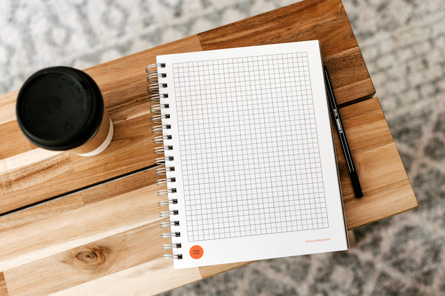 Professional A5 spiral-bound notebook featuring a quality grid template, perfect for organizing notes, sketches, and daily work. The compact size and durable spiral binding make it ideal for office use and on-the-go productivity. Our template notebooks blend functionality with elegant design for professionals seeking practical organization.