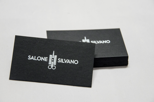 Professional black business cards featuring elegant white printed design. Personalize with your logo and contact information to create a sophisticated, premium image. Perfect for making lasting impressions with high-quality black cardstock and crisp white printing.