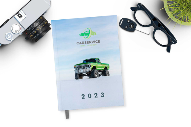 CarService 2023 thread-sewn daily agenda green truck photo cover on. Thread-sewn daily agenda CarService 2023 with green truck photo cover on white desk. 336 pages Sprint24.