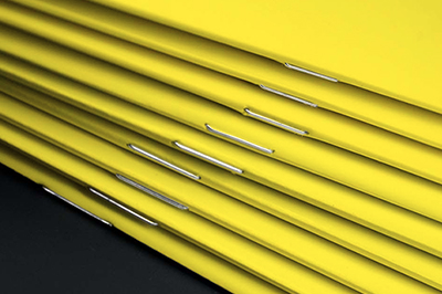 Metal stitch binding reinforces printed products with professional, eye-catching metallic stitching along the spine. Ideal for brochures, catalogs, and bound documents requiring durability and premium aesthetics. This binding method combines structural strength with decorative appeal for high-quality finishing at competitive prices.