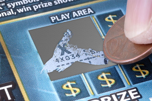 A custom-printed scratch card with the silver removable patina being scratched by a coin to reveal a winning prize symbol on the play area. Sprint24 prints custom scratch cards with progressive numbering, alphanumeric codes and barcodes — ideal for promotional campaigns, contests, gift vouchers and direct marketing initiatives.