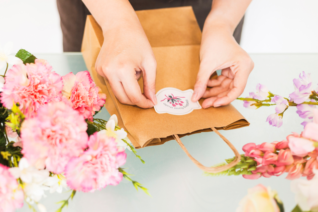 Custom-shaped paper stickers featuring your branded logo, presented in premium kraft packaging. Distribute them to customers as unique business cards or professional marketing materials with personalized die-cut shapes.