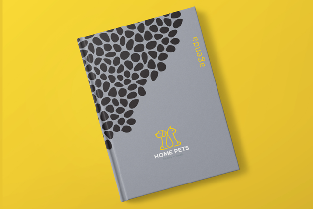 Grey weekly hardback agenda with black pebble pattern and Home Pets yellow logo. 128 pages 3 layouts Sprint24.
