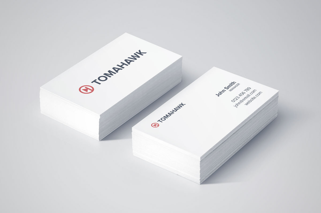 Premium extra-thick 400gr business cards in pristine white cardstock featuring the Tomahawk logo with minimalist design. Printed on coated paper, these classic business cards deliver professional quality and simple elegance for your commercial activity.