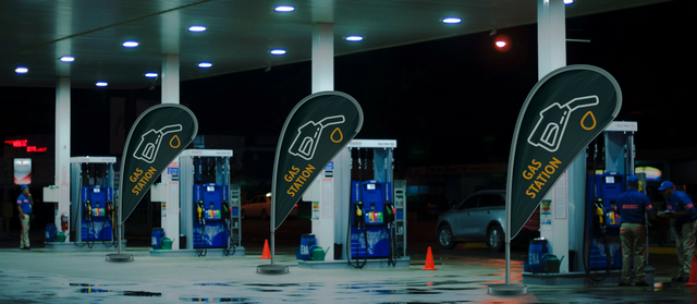 High-visibility teardrop-shaped drop flag displays designed specifically for outdoor gas station branding and promotional signage. These fabric banners feature bold printed designs and are mounted on poles for maximum visibility in automotive environments. Sprint24 offers professionally printed drop flags on durable, weather-resistant fabric perfect for long-lasting outdoor advertising at fuel st…