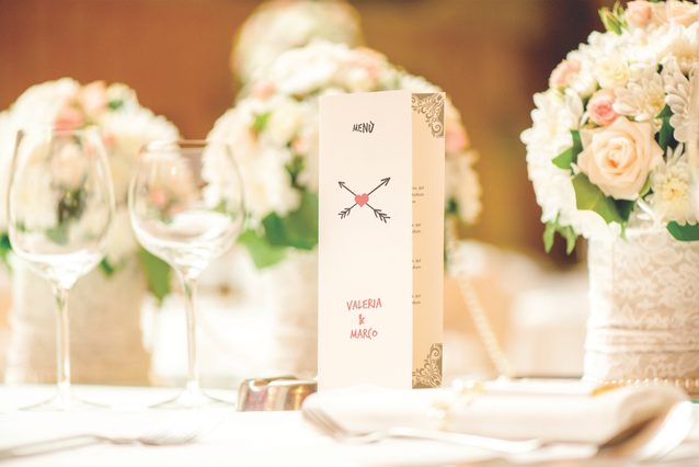 This elegant minimalist wedding menu features a sophisticated cream card design with delicate crossed-utensil detailing, ideal for formal wedding receptions and upscale restaurant service. The refined aesthetic complements any wedding theme and creates a memorable table setting for your guests. Personalize this wedding menu template with Sprint24's online printing service to match your special ce…