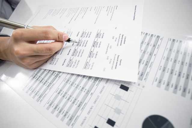 Professional printed presentation cards and datasheets displaying organized tabular information and structured data. Perfect for synthesizing complex information into comprehensive reference sheets for business and office use.