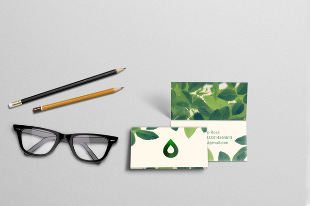 Display of professionally printed green botanical folded business cards with double-fold spacing. Perfect for customizing visit cards for doctors, medical centres, and business meetings. Available online with high-quality printing and convenient fidelity card options.