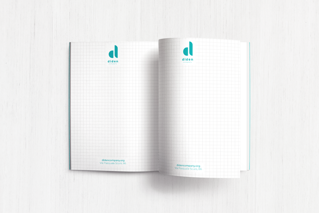 An open custom paperback notebook for 'Dibas' brand showing squared grid inner pages with the company logo and URL printed in the header of both pages. Sprint24 prints personalised paperback notebooks with grid or lined pages in A4 and A5 formats — ideal for branded corporate stationery, office notepads and professional marketing giveaways.