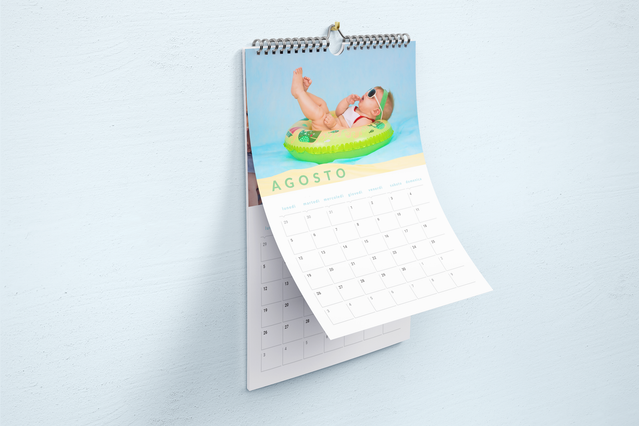 Personalized photo calendar featuring a colorful family photograph displayed prominently above the monthly calendar grid. This custom desk calendar combines your favorite memories with practical date organization, making it an ideal gift for family and friends.