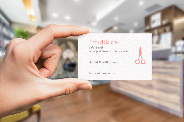Professional hairstylist business card example showcased in a modern salon environment. Custom-printed cards are essential for salon owners and stylists to share contact information and build lasting client relationships. High-quality designs available for online printing with affordable pricing and easy customization options.