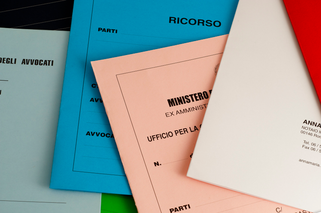 Multiple simple promotional folders displayed in vibrant colors including blue, pink, white, and red, each featuring personalized printed text and branding. These customizable folders showcase different design options and color variations suitable for office presentations, agency use, and promotional applications with professional finishing.