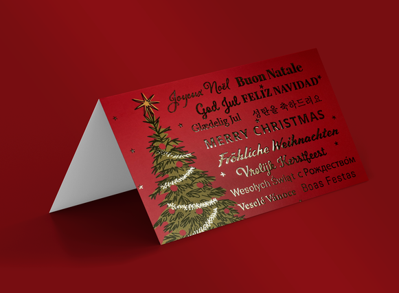 Red folded Christmas card gold multilingual Merry Christmas text and. Red folded Christmas card with gold multilingual Merry Christmas text and illustrated tree. Sprint24.