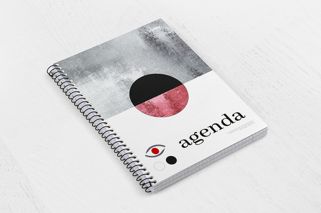 Spiral weekly agenda grey texture red black circle abstract art cover. Spiral weekly agenda with grey painted texture, split red black circle and eye logo cover. 128 pages Sprint24.