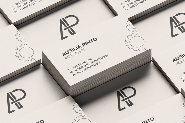 A stack of clean white business cards for 'Ausilia Pinto, Ingegnere' featuring a bold geometric 'AP' monogram logo and subtle gear icons in the background. Custom-printed engineer business cards with professional minimalist design help civil, mechanical and IT engineers make a strong first impression and build their professional network at meetings, conferences and trade events.