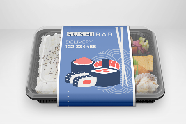 A takeaway sushi tray sealed with a custom-printed blue external band for 'Sushi Bar' featuring sushi illustrations and a delivery phone number, wrapped around a black tray containing rice and sushi pieces. These personalised box bands are ideal for sushi bars, restaurants and food delivery businesses seeking branded packaging bands that transform plain takeaway containers into premium branded pa…