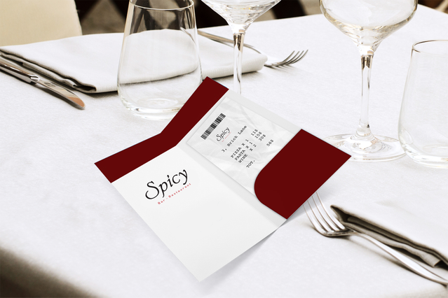 Premium white bill holder with custom branding and a die-cut red pocket for receipts, featured in an upscale restaurant table setting. The colored pocket insert enhances table presentation while securely holding bills and receipts. Customize your bill holders with colored pockets and branded printing through Sprint24's online printing service for restaurants, cafés, bars, and catering establishme…