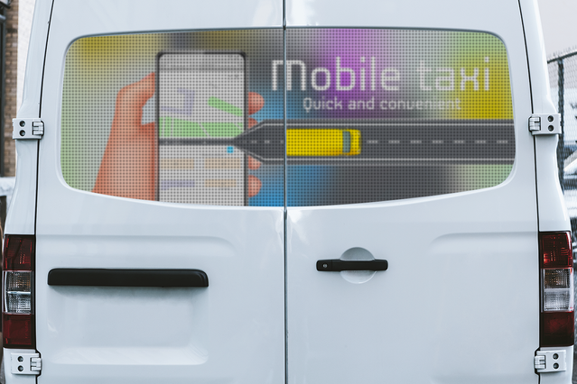 This one-way vehicle sticker showcases professional taxi branding applied to a white van's rear window. The one-way film allows interior visibility while providing complete privacy from external observers, protecting both contents and driver identity. Ideal for commercial vehicles requiring durable window protection and custom branding.