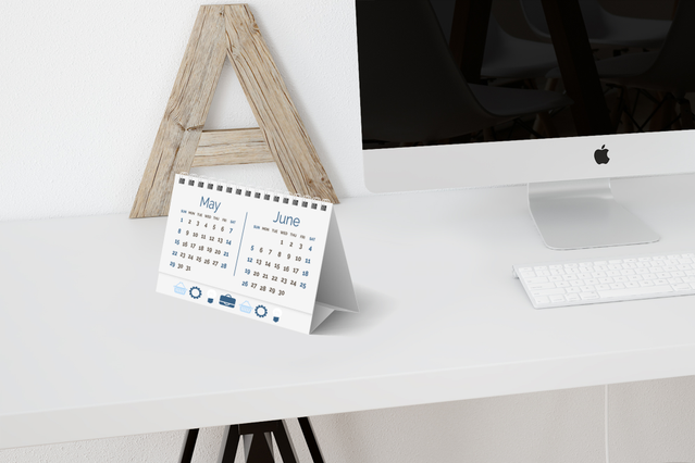 This custom desk calendar features a sleek wooden stand that adds a modern touch to any office workspace. Perfect for organizing your schedule while enhancing your desk décor with a professional, designer aesthetic. Ideal for businesses seeking practical branded items that clients will use and display daily.